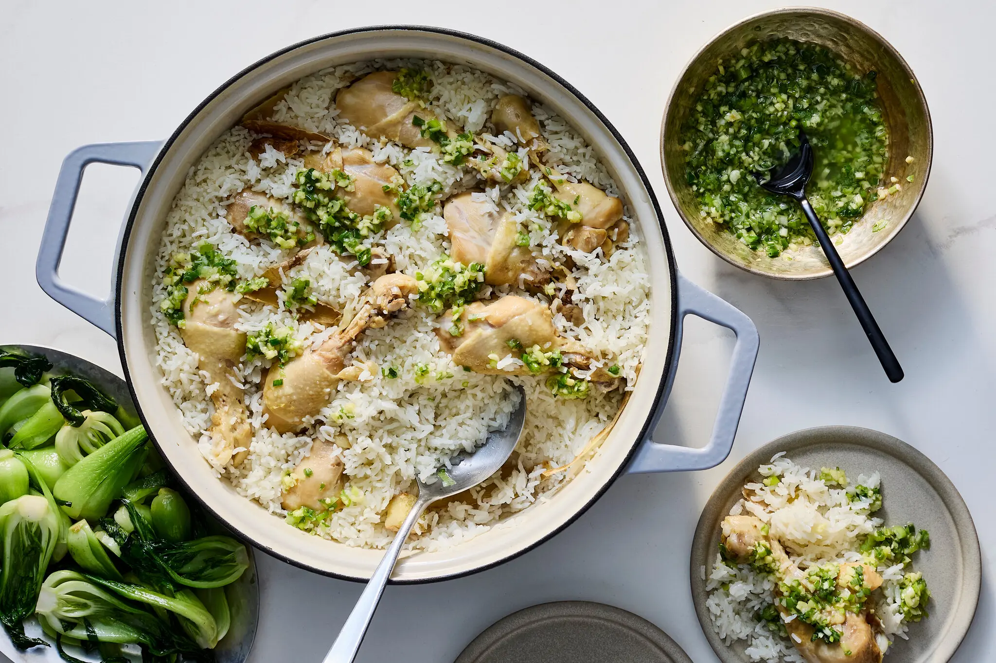 This shortcut chicken with ginger-scallion sauce is a take on Hainanese chicken rice.Credit...Nico Schinco for The New York Times. Food Stylist Barrett Washburne.